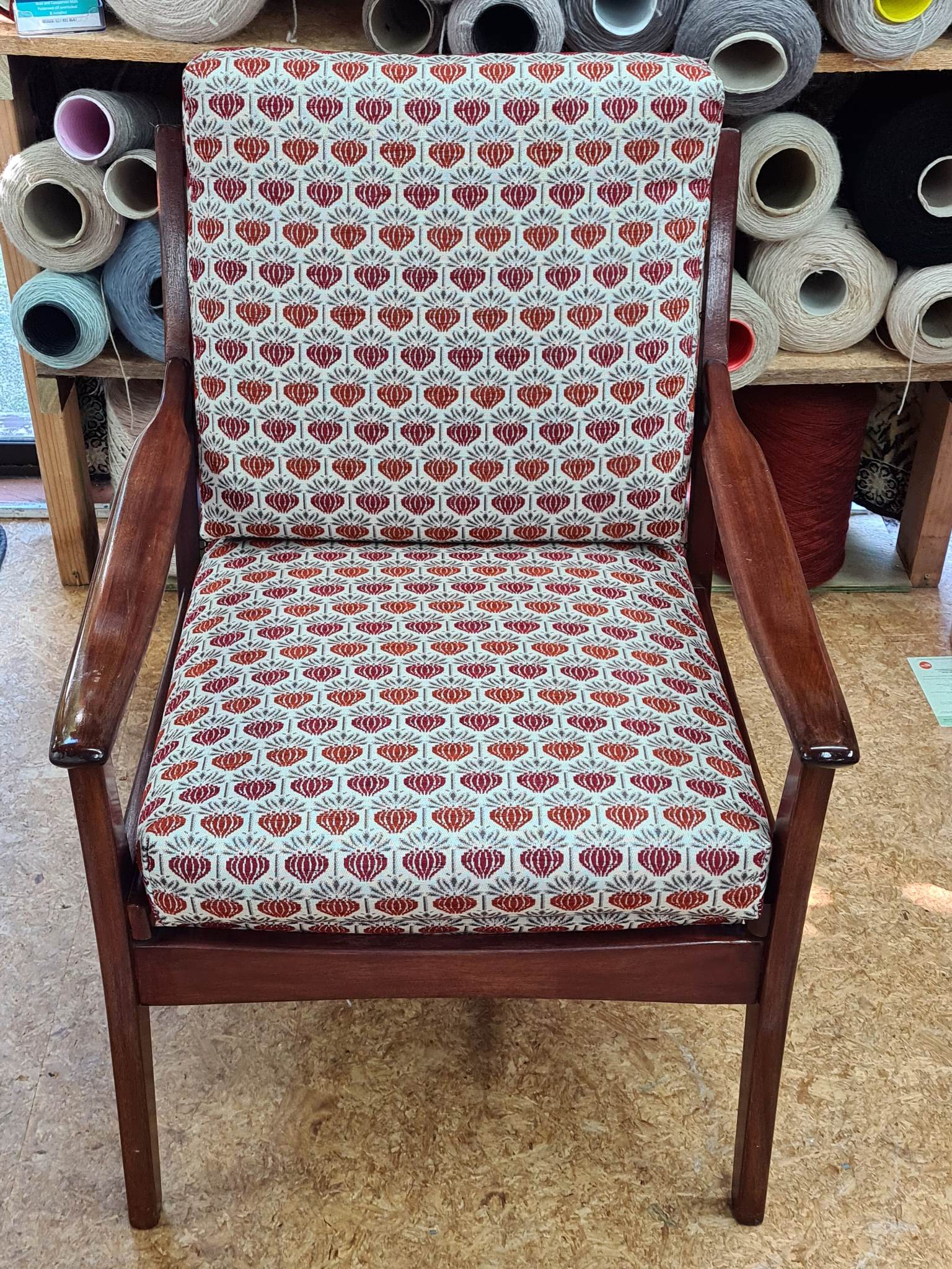 Reupholstered mid-century armchair with a geometric fabric